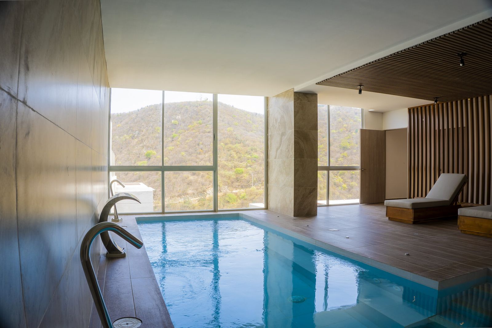 Covered rooftop pool at the Delventto building